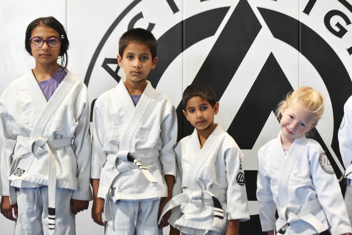 Kids in white Jiu-Jitsu uniforms at Gracie Fighter Bay Area